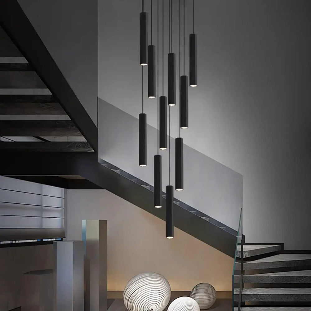 Suspension luminaire escalier design cylindres noirs