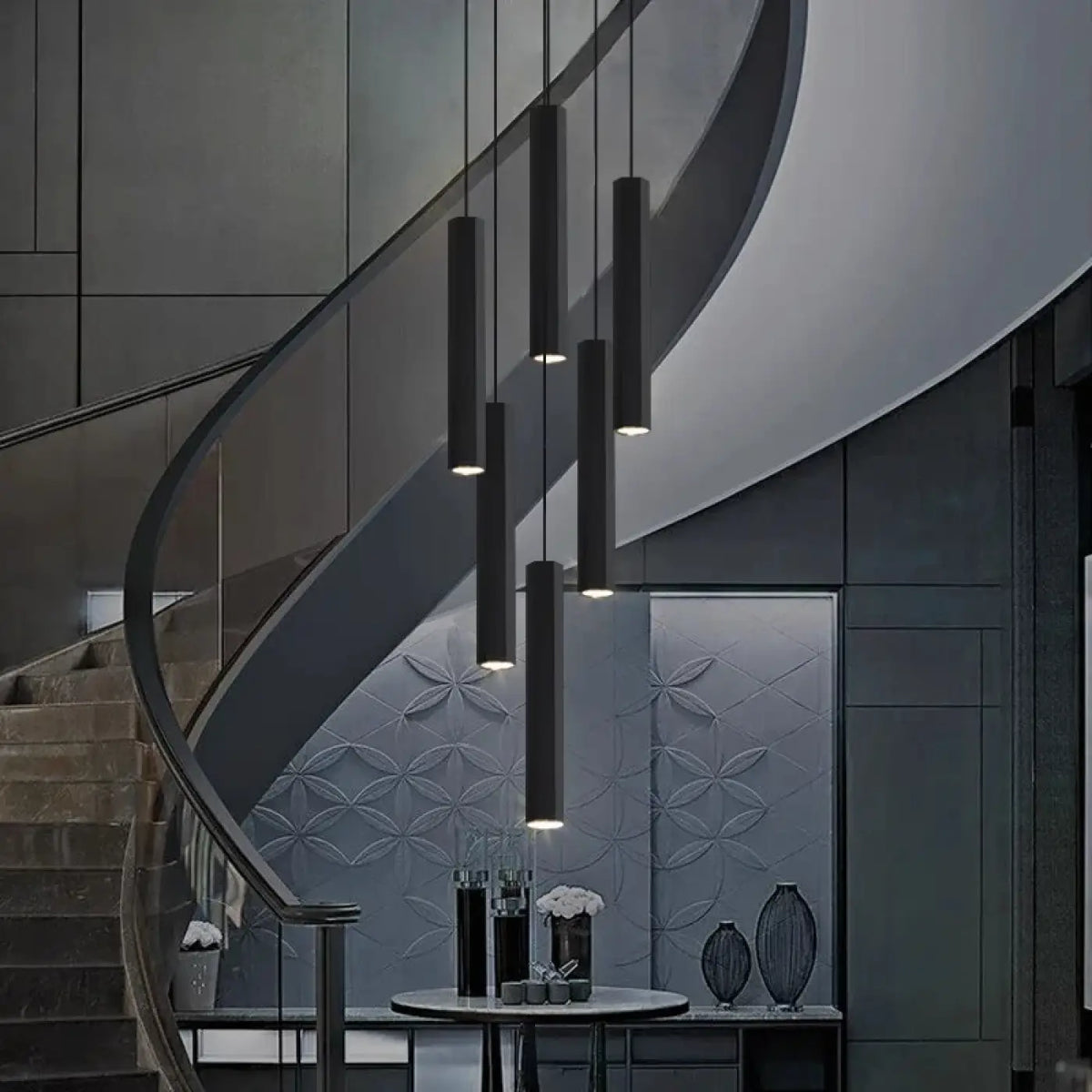 Suspension luminaire escalier design cylindres noirs