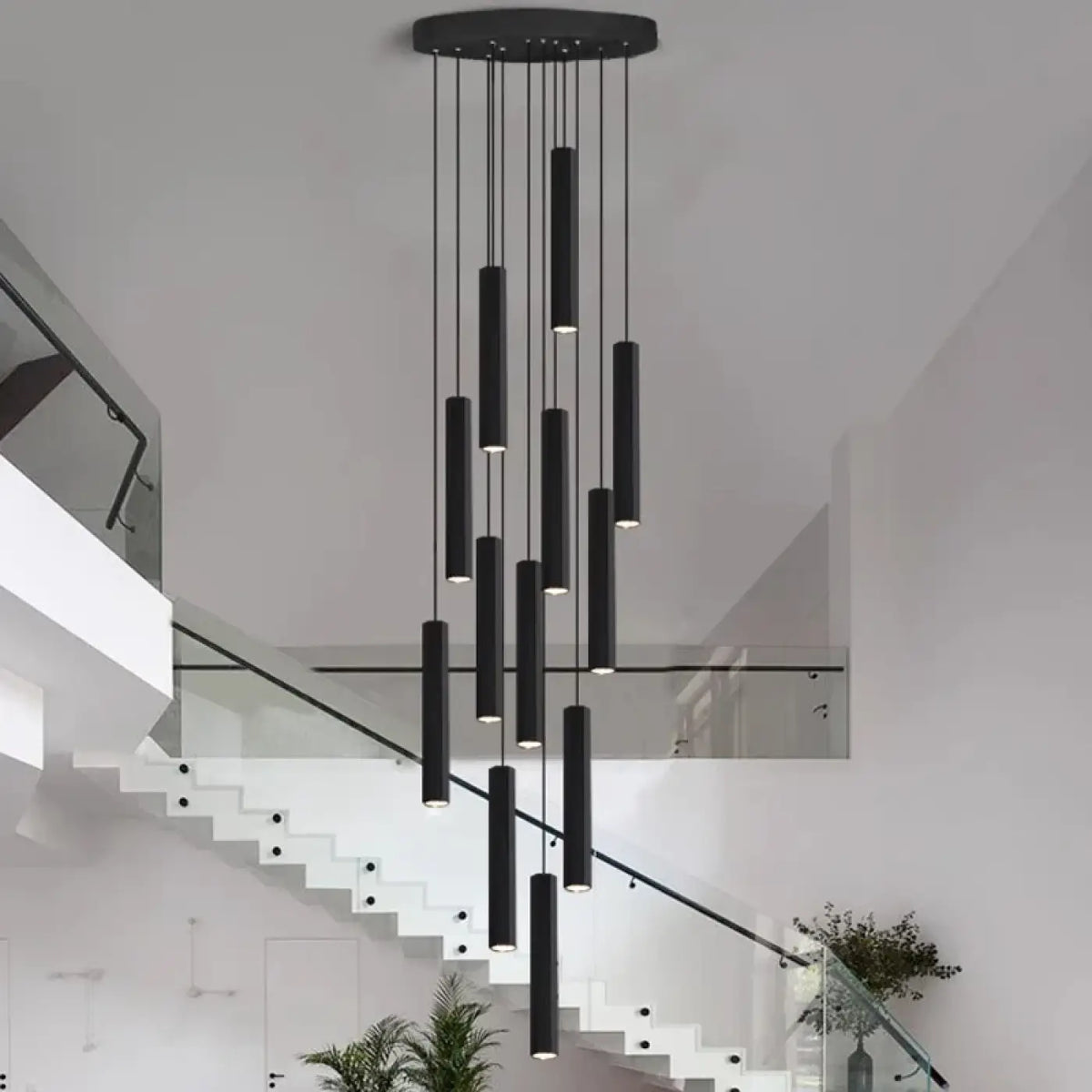 Suspension luminaire escalier design cylindres noirs