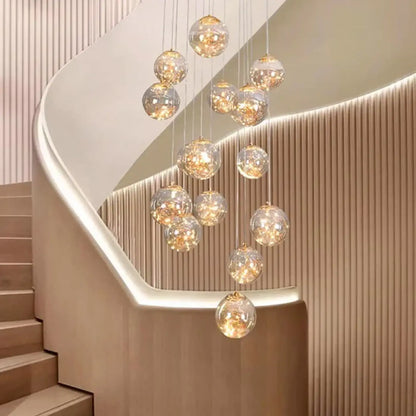 Suspension luminaire escaliers boules cristal dorees