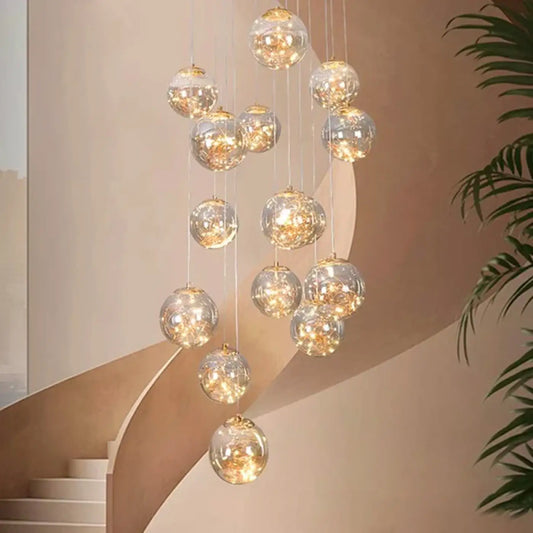Suspension luminaire escaliers boules cristal dorees